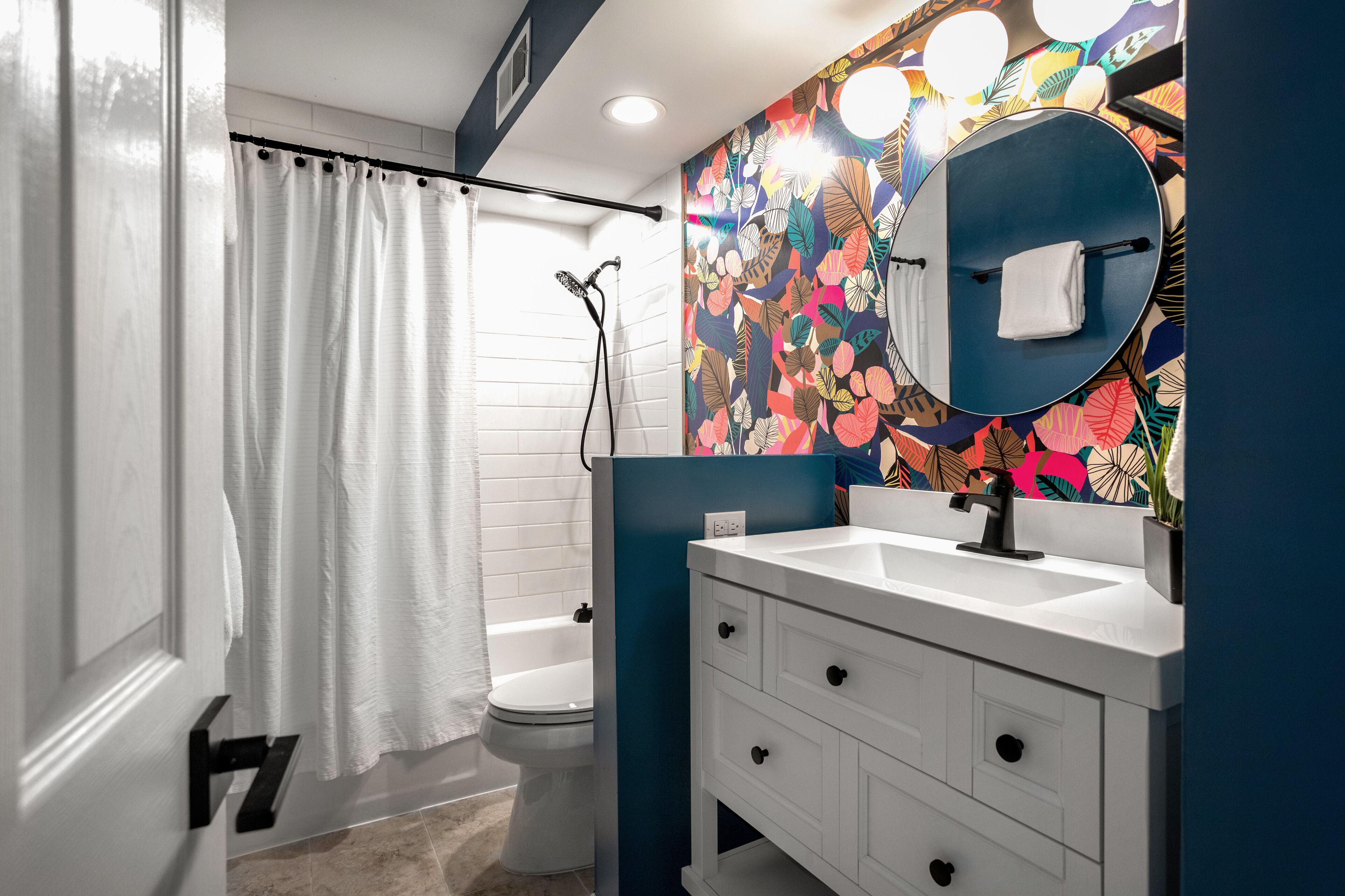 Combined shower/bathtub, towels, soap, toilet paper