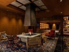 A lobby with a fire feature, seating, and a patterned carpet. - Mercure Hida Takayama (Takayama)