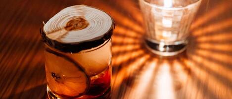 Two glass containers on a wooden surface.