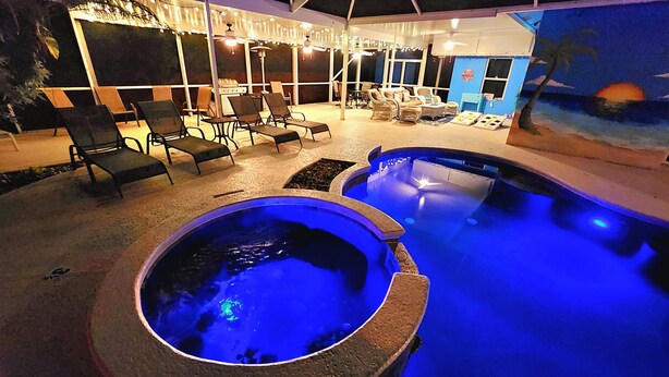 An indoor pool area with seating and a hot tub. - Beach like you've never seen! Heated pool/spa! (Port St. Lucie)