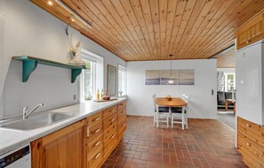 Fridge, stovetop, dishwasher, coffee/tea maker