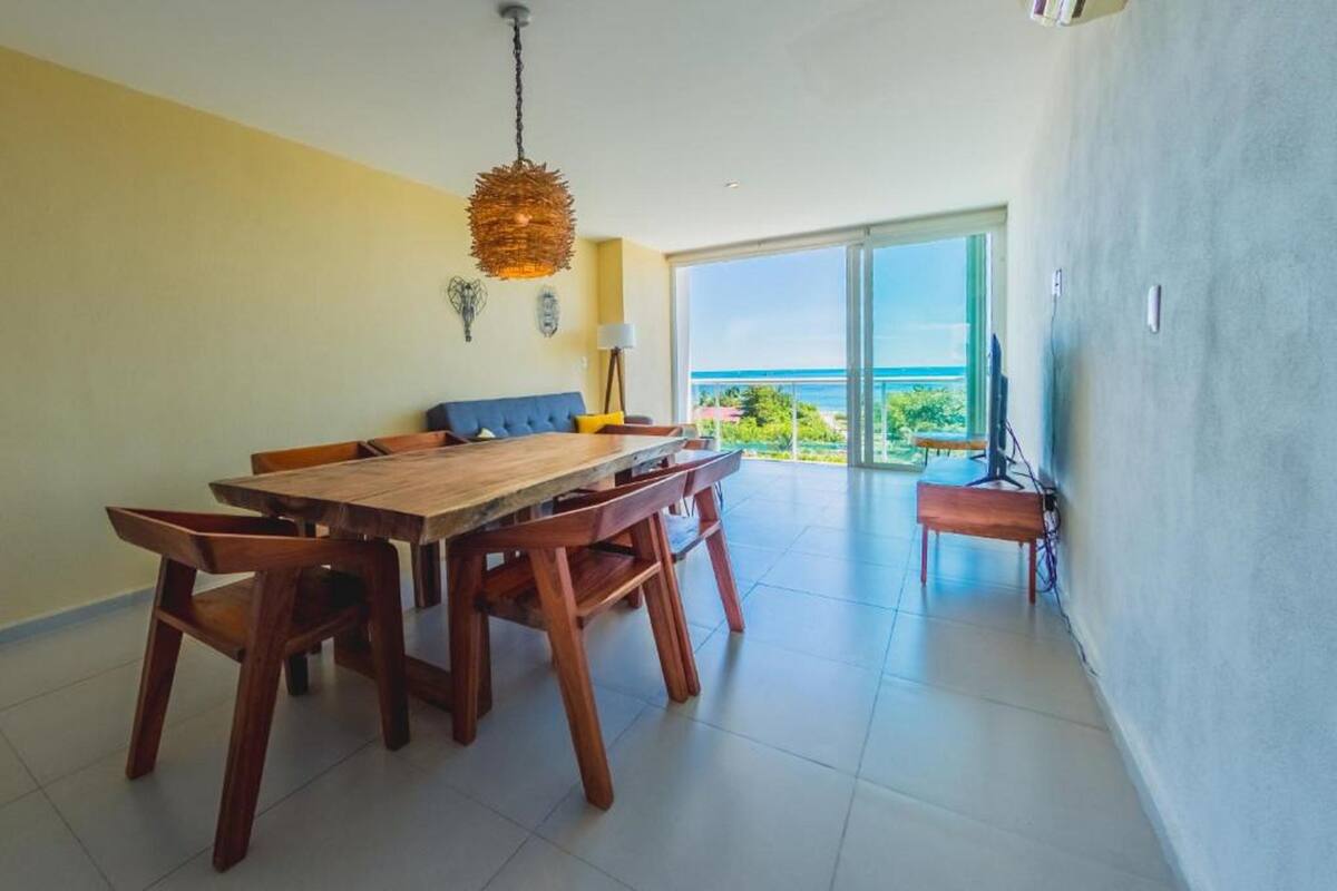 Departamento Deluxe, 2 habitaciones, vista parcial al mar, junto a la playa | Comedor