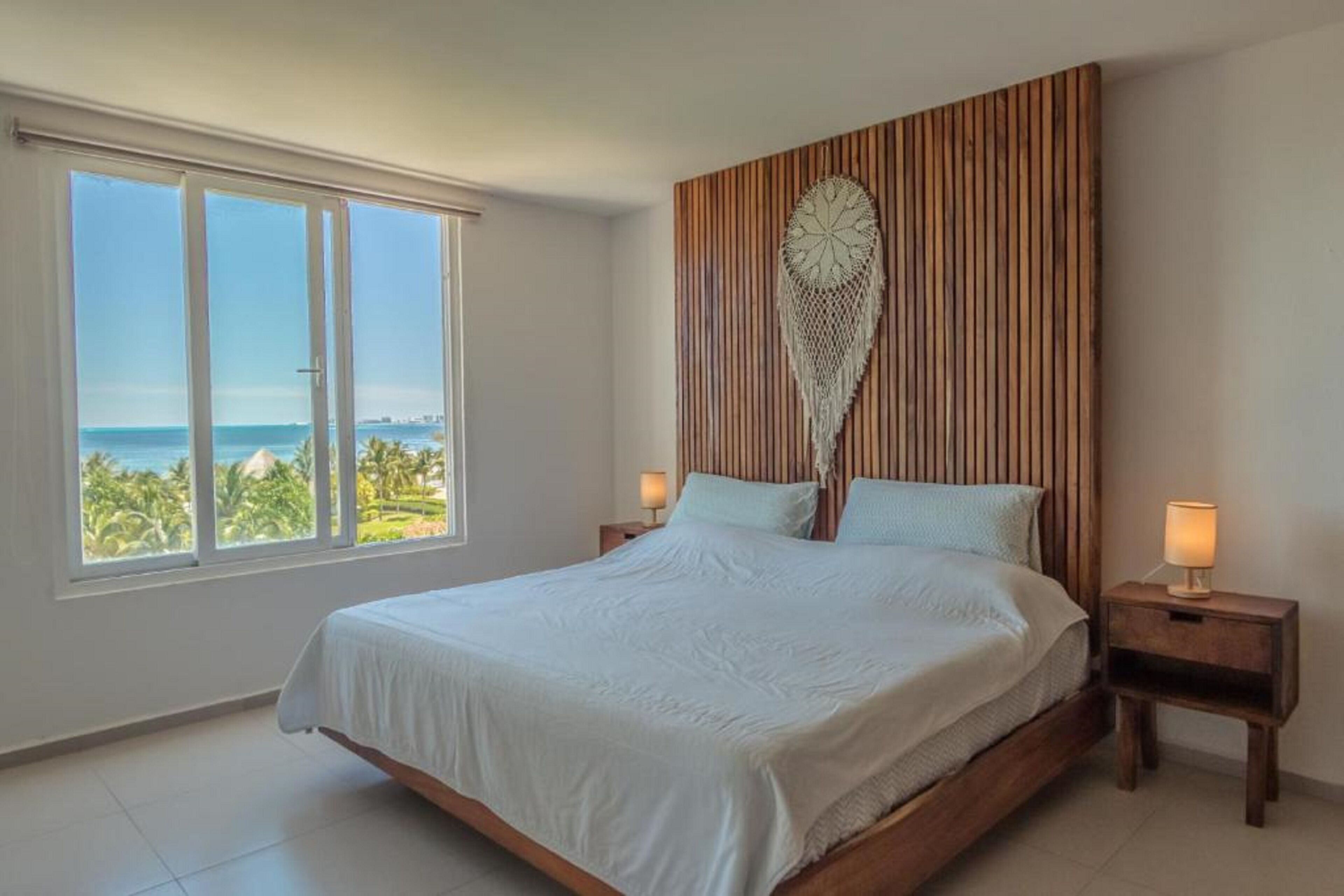 Deluxe Apartment, 2 Bedrooms, Partial Sea View, Beachside | In-room safe, laptop workspace, blackout curtains, iron/ironing board
