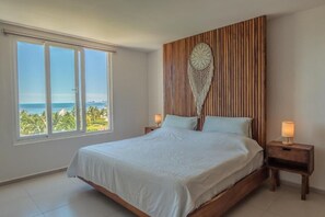 Deluxe Apartment, 2 Bedrooms, Partial Sea View, Beachside | In-room safe, laptop workspace, blackout curtains, iron/ironing board - Apartamentos de lujo frente al Mar Caribe (Cancun)