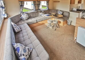 Living area - Spacious and well-presented 12ft-wide caravan with one double and one twin. (Ludchurch, Nr Saundersfoot)