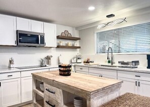 Fridge, microwave, stovetop, coffee/tea maker