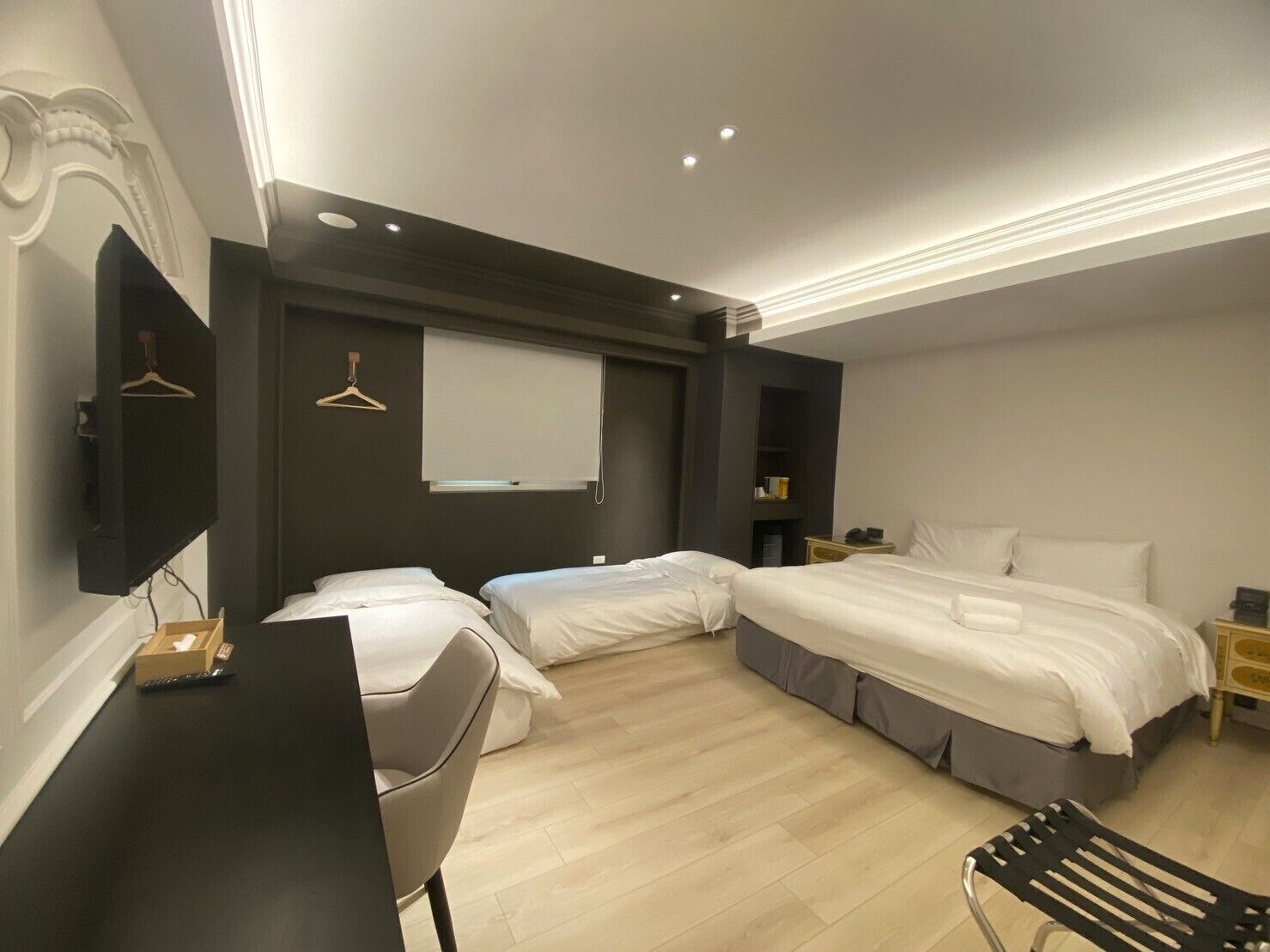 Deluxe Quadruple Room | Minibar, desk, laptop workspace, blackout drapes