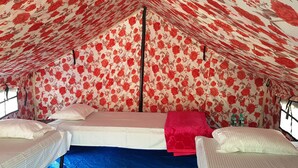 A tent with a floral pattern, two beds, and a window. - The Raajas - Camp & Resorts (Yamkeshwar)