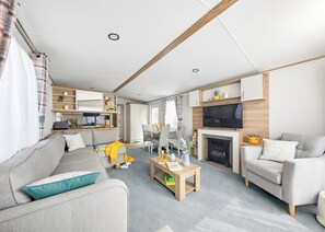 Living area - Stylish and spacious 12ft-wide caravan with one double and two twin. (Clunderwen, Nr Narberth)