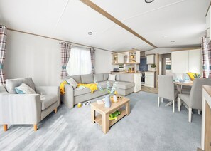 Living area - Stylish and spacious 12ft-wide caravan with one double and two twin. (Clunderwen, Nr Narberth)