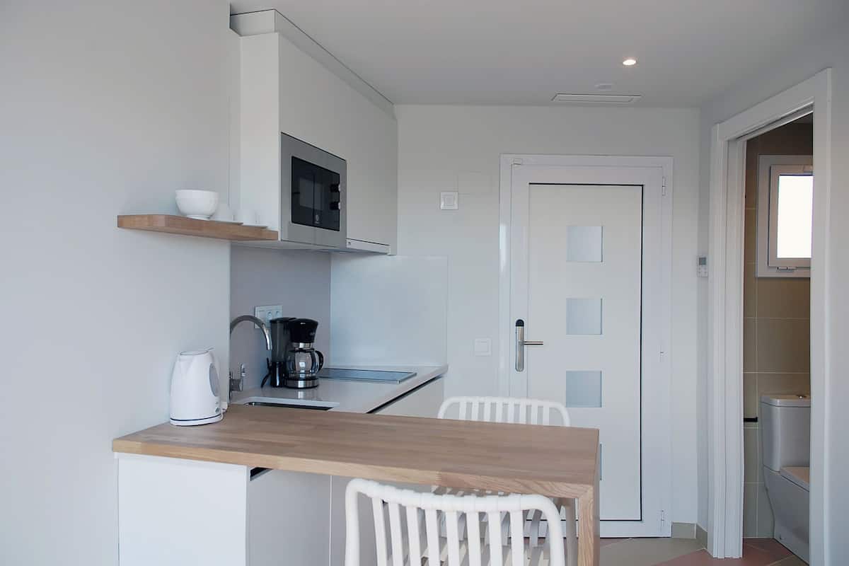Studio | Private kitchen | Full-size fridge, microwave, coffee/tea maker, highchair