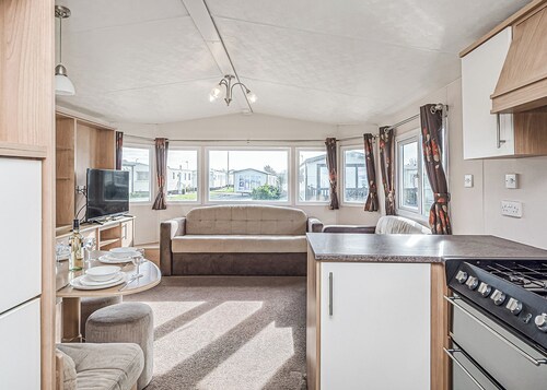 12ft-wide quality caravan with one double and two twin.
