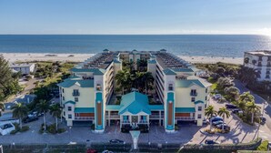 A hotel with a central courtyard, multiple floors, and a beach view. - 607S-Penthouse-Gulf View, Top Floor, 2/2 on Beach (Treasure Island)
