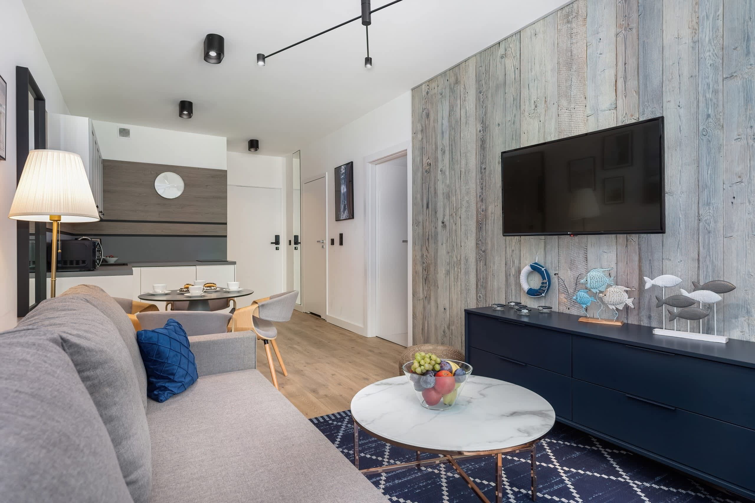 Living room with a comfortable sofa and TV. 