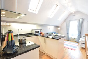 Fridge, dishwasher, cookware/dishes/utensils