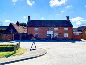 A traditional brick building with a sign reading "The Westleton Crown." - Satis Cottage, Westleton (Saxmundham)