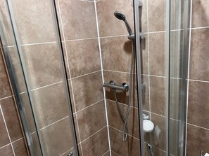 Apartment, 1 Queen Bed | Bathroom | Shower, hair dryer, towels