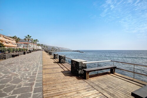Vacation Rental 'Apartamento Caletillas Alan' with Shared Pools, Terrace, and Wi-Fi