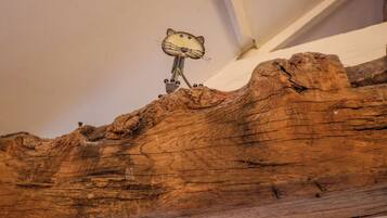 A wooden structure with a cat-shaped object mounted on it.