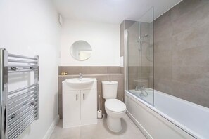 Shower, hair dryer, towels, shampoo