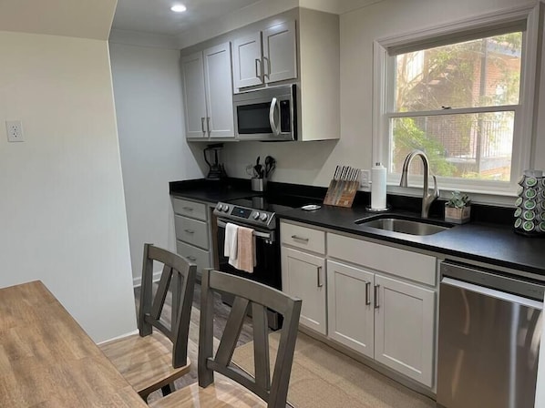 Enjoy cooking in this well-equipped kitchen with an oven, microwave, and dishwasher.