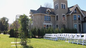 A large, historic building with a symmetrical facade, multiple windows, and a prominent tower. - Wilbur Mansion (Bethlehem)
