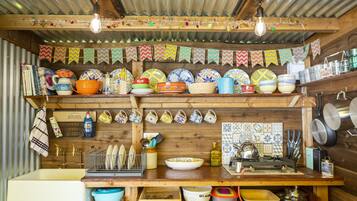 Cabin | Private kitchen | Microwave, stovetop, electric kettle, toaster
