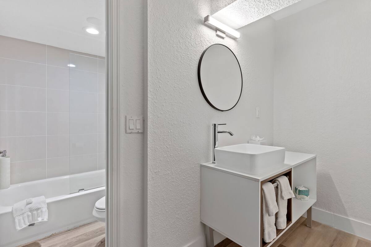 combined shower/bathtub, hair dryer, towels, soap