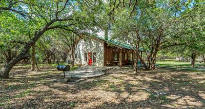 Steps from THE Frio River with river access included, the perfect Concan cottage with the best price