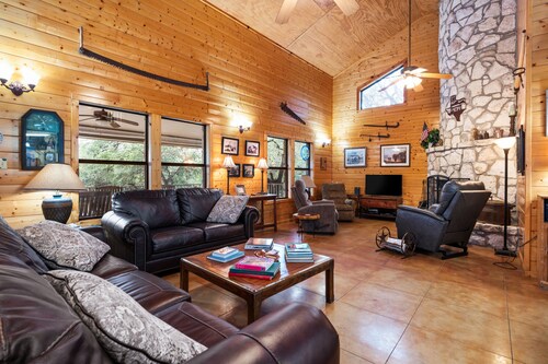 Directly ON the Frio River with exclusive river frontage, shuffleboard table & room for 25 guests