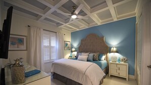 A bedroom with a bed, bedside tables, a ceiling fan, and a window with curtains. - Charming 3Bd Pool TH The Enclaves at Festival-350CD-NEW (Davenport)