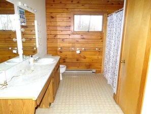 Combined shower/bathtub, soap, toilet paper