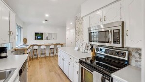 Coffee/tea maker, fridge, microwave, oven