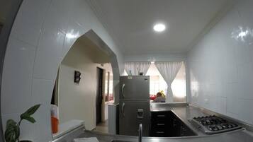 Fridge, stovetop, dining tables