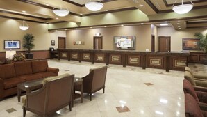 A hotel lobby with a reception desk, seating area, and a sign indicating 'Holiday Inn Club Vacations'. - In The Center Of It All, Right Next To The Sphere, Ten Minute Walk To The Strip (Las Vegas)