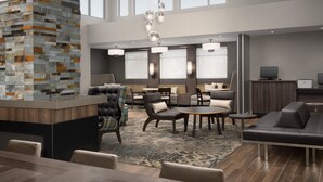 A spacious hotel lobby with a modern bar area, comfortable seating, and large windows providing natural light. - Residence Inn By Marriott Fresno Clovis (Clovis)