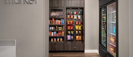 A grocery store interior with wooden cabinets and a refrigerated display.
