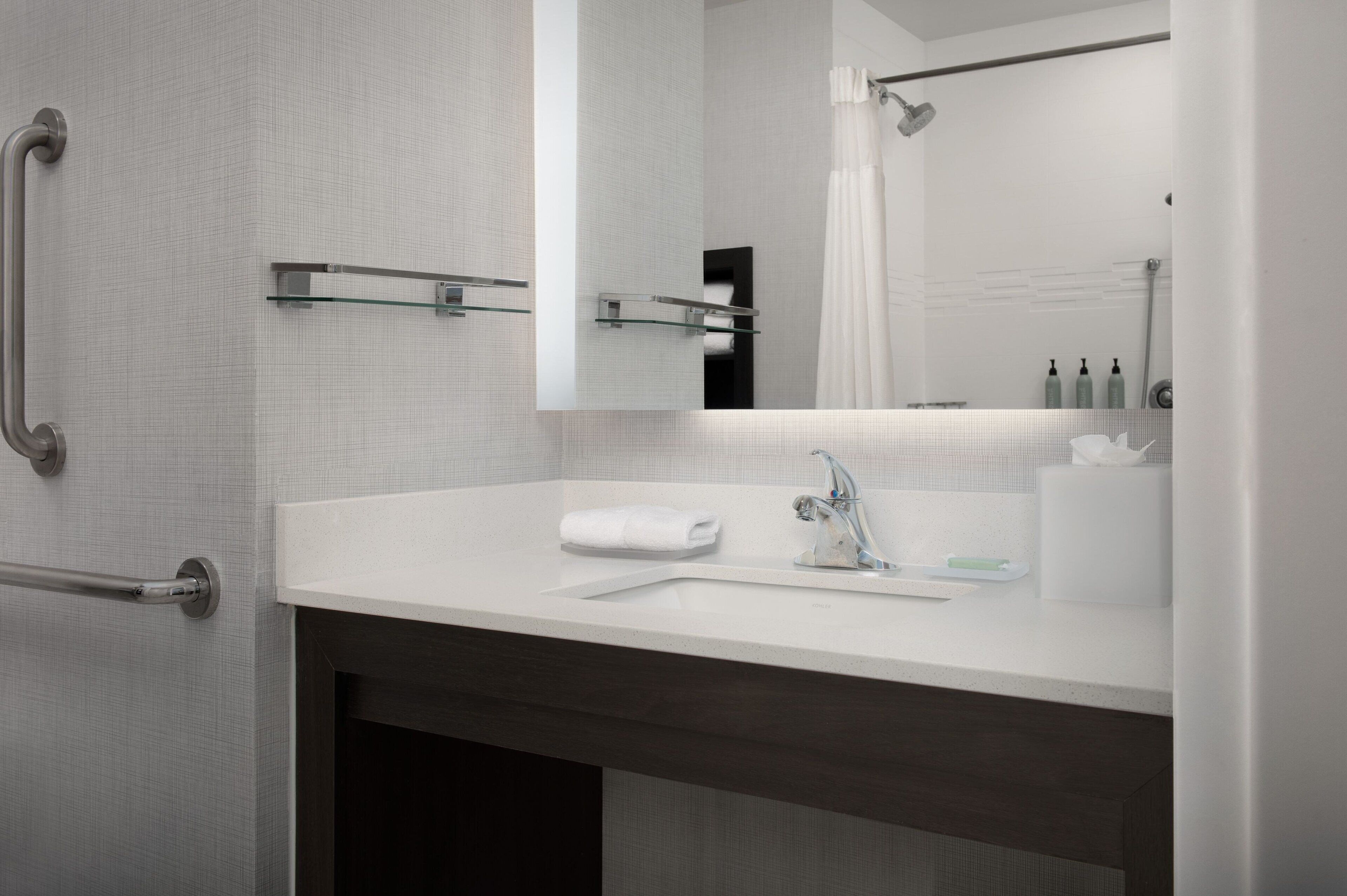 shower, hydromassage showerhead, hair dryer, towels