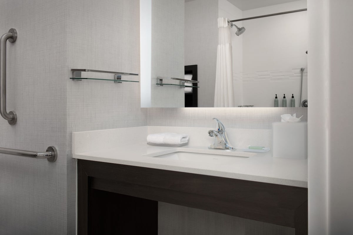 shower, hydromassage showerhead, hair dryer, towels