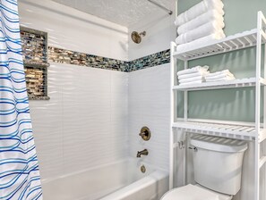 Combined shower/bathtub, hair dryer, towels, soap