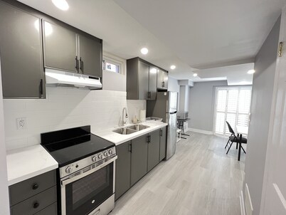 One bedroom ensuite toilet on main level & kitchen, living, bathroom lower level