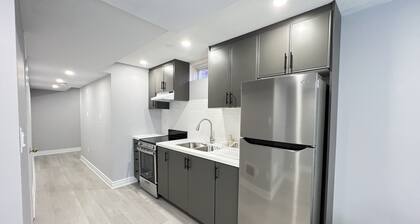 One bedroom ensuite toilet on main level & kitchen, living, bathroom lower level