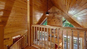 A wooden interior with a sloped ceiling, a ceiling fan, and a view to an outdoor deck. - Spacious Retreat on Dale Hollow! Walking distance to Safe Harbor Wisdom Dock. (Albany)