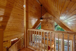 A wooden interior with a sloped ceiling, a ceiling fan, and a view to an outdoor deck. - Spacious Retreat on Dale Hollow! Walking distance to Safe Harbor Wisdom Dock. (Albany)
