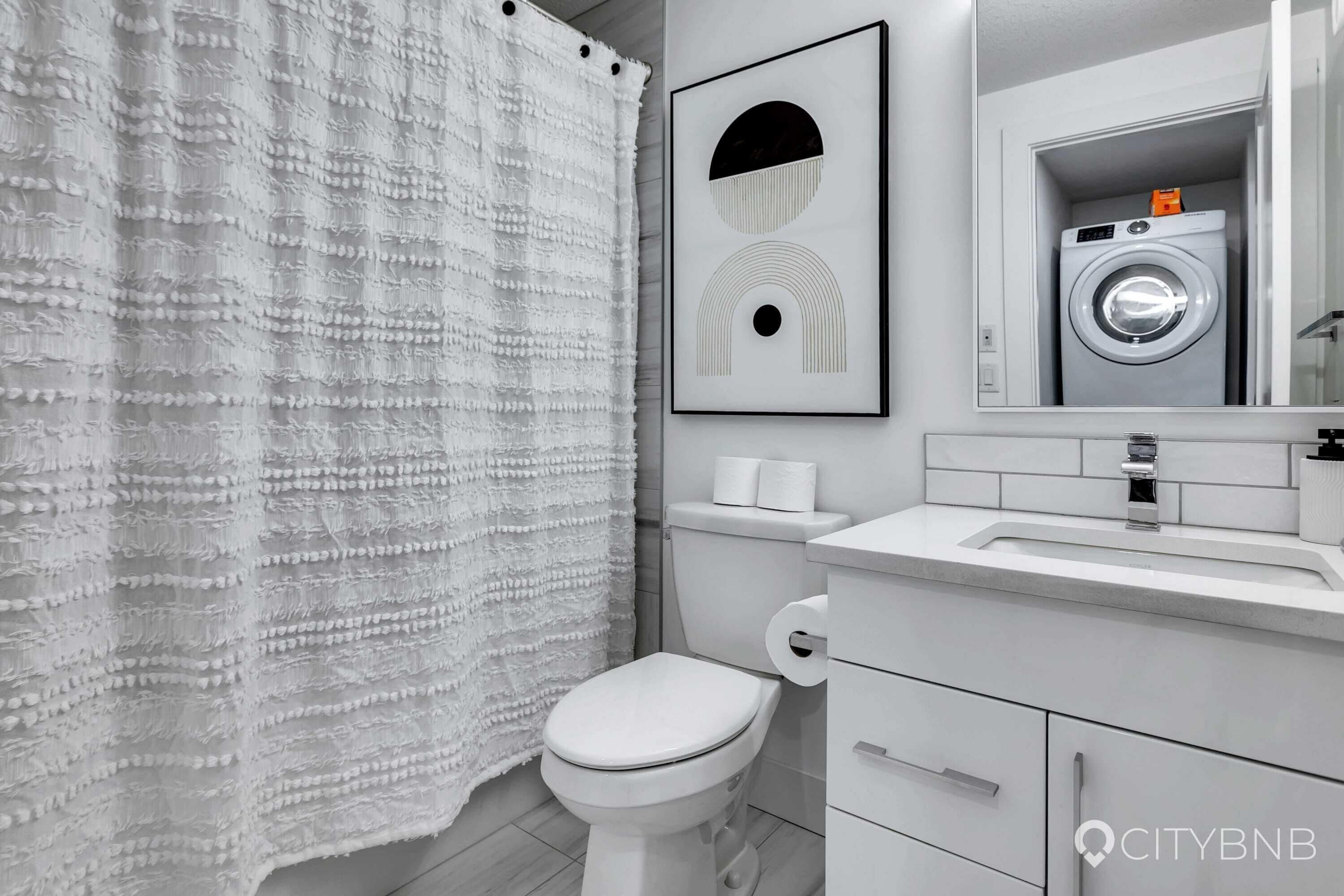 Bathtub, hair dryer, towels, soap