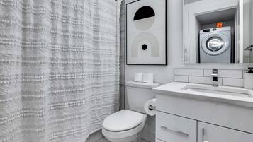 Bathtub, hair dryer, towels, soap