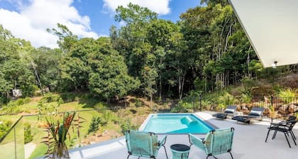 Treetops Retreat: A Serene Rainforest Escape with Mountain Views