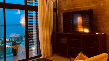 Junior Suite, Bay View | Living area | 75-inch Smart TV with digital channels, TV, Netflix