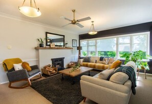 TV, fireplace - A Cosy Hideaway | Hot Tub, Garden & Warm Character Home (Rotorua)
