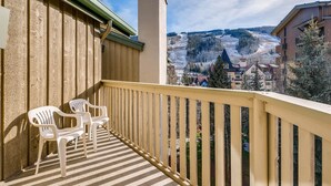 A balcony with a view of a snowy landscape. - Westwind 406 2BD 2BA Diamond Condo in Lionshead Village (Vail)